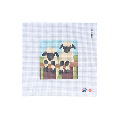 Two Sheep On Fence
